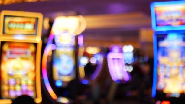 Live casino dealer at multi-camera studio broadcasting blackjack and roulette